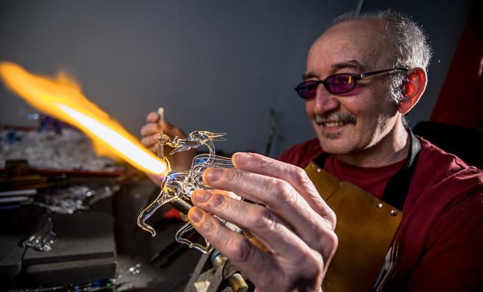 Delyn Glass at Corris Craft Centre work with glass and create stunning sculptures of wildlife, flowers and fantasy dragons. Kevin can be seen with a h